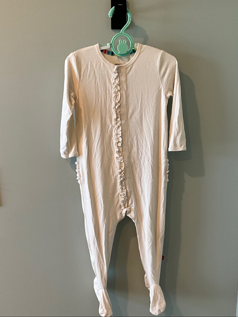 Magnetic Me Cream Ruffle Front Footed One-Piece